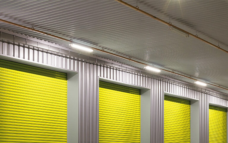 LED Batten Lights mounted above yellow warehouse roller doors